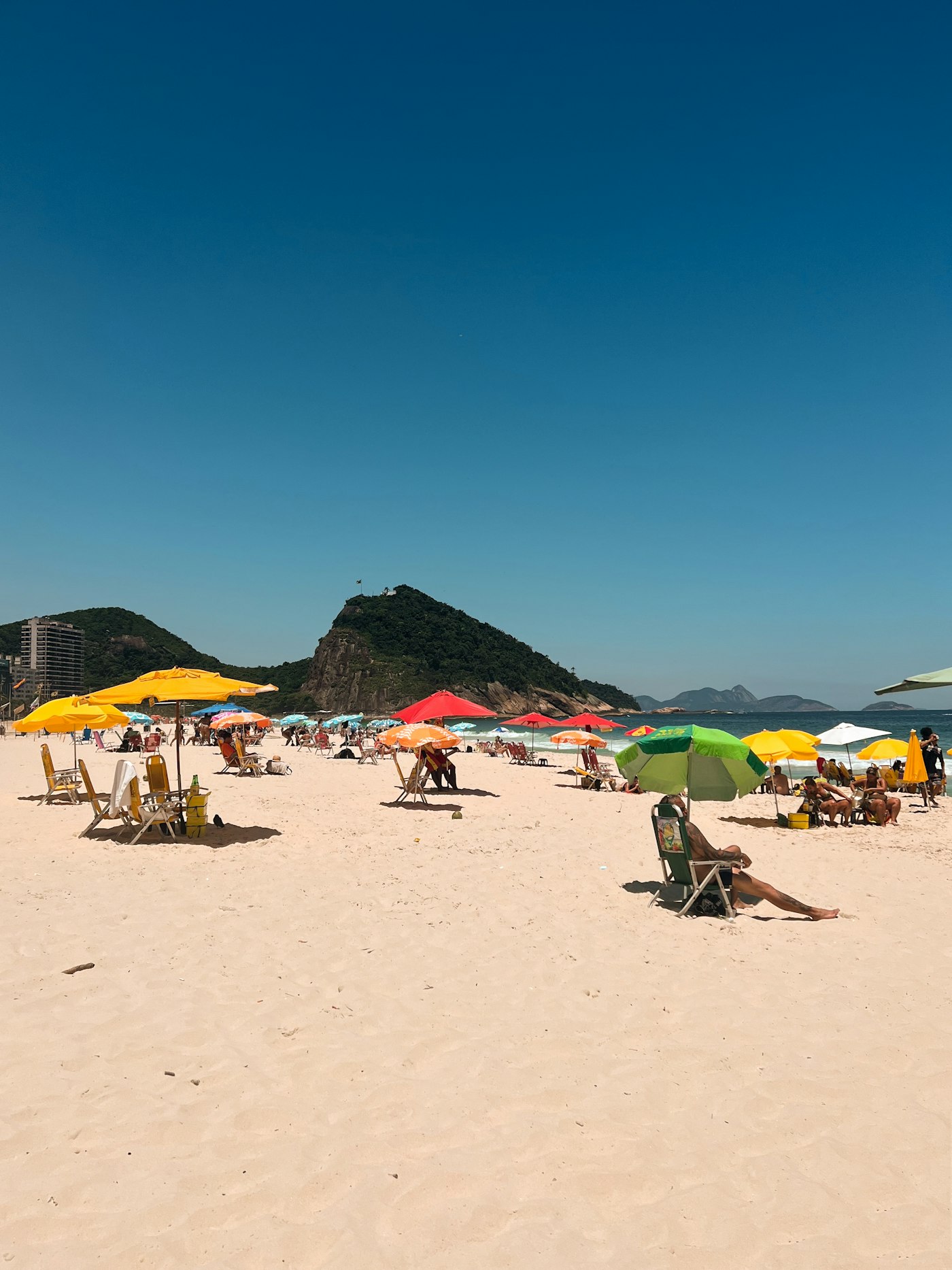 Copacabana beach with umbrellas in Rio de Janeiro — money safety and tourist scams